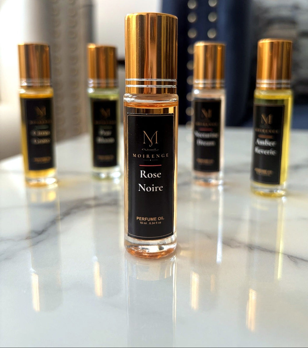 Rose Noire Perfume Oil 10 ml bottle standing on a marble top.