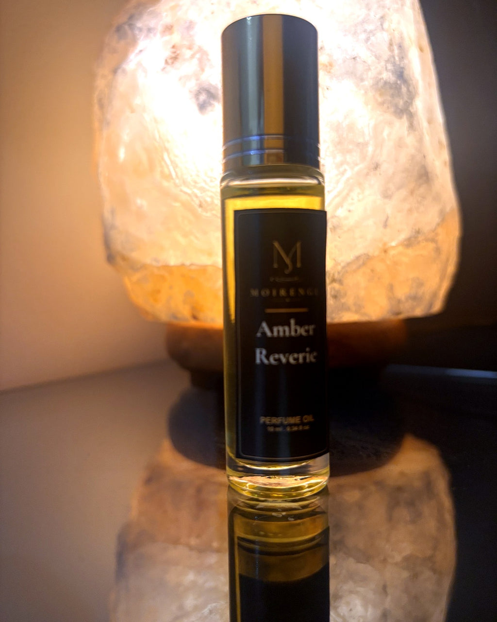 Amber Reviere bottle in front of a warm amber light